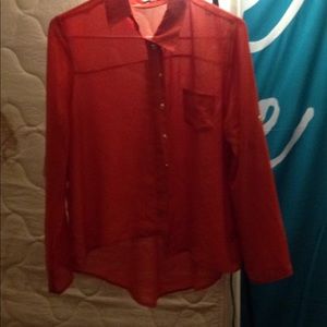 A long sleeved red-orange papaya shirt